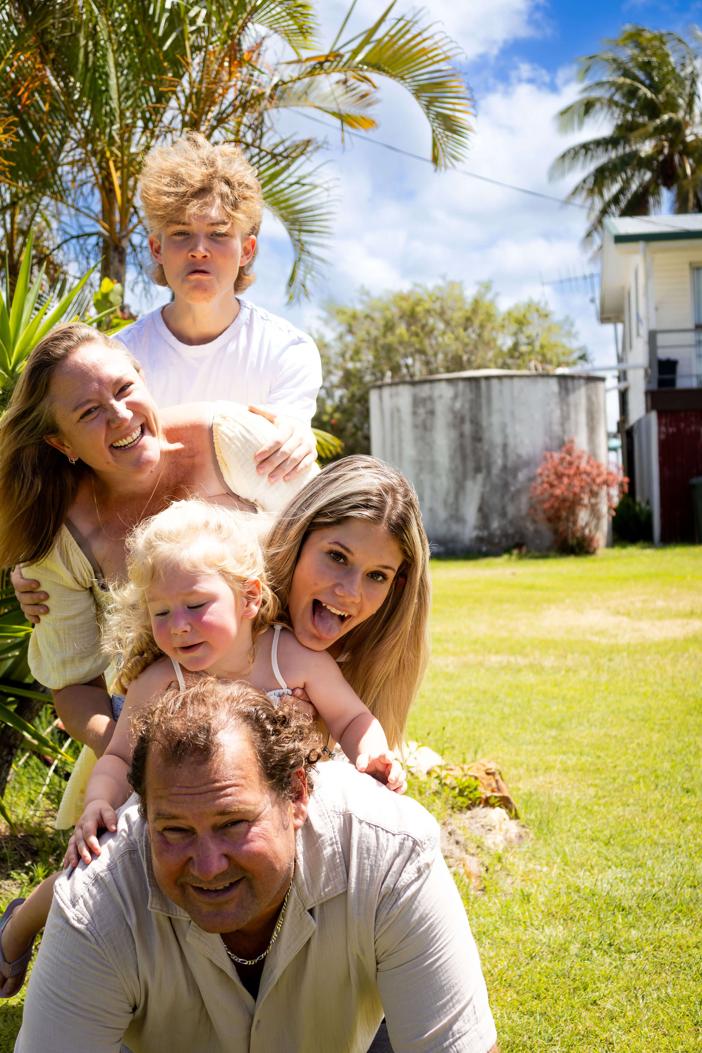 a loving family all stacked on top of each other
