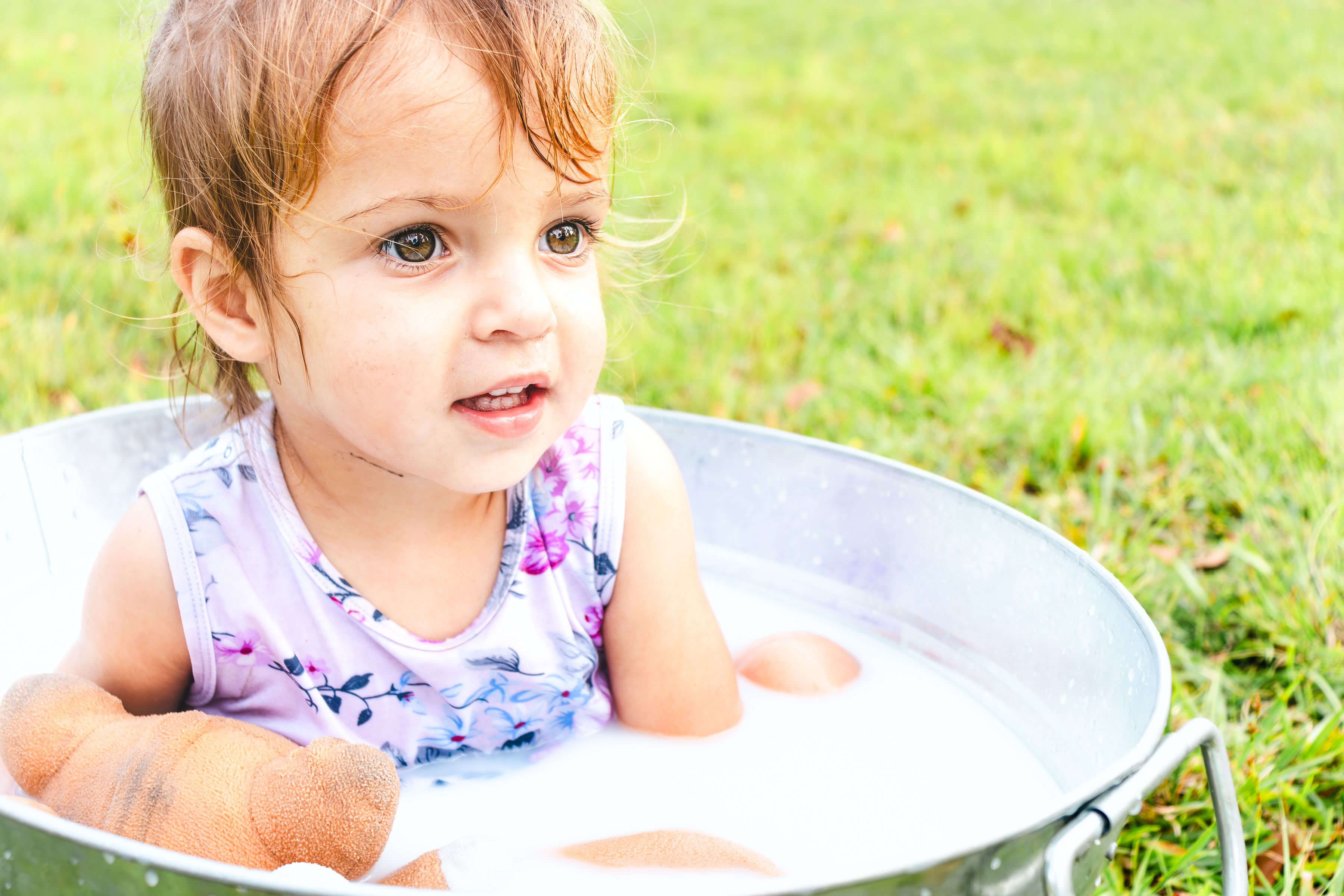 a child in a milk bath