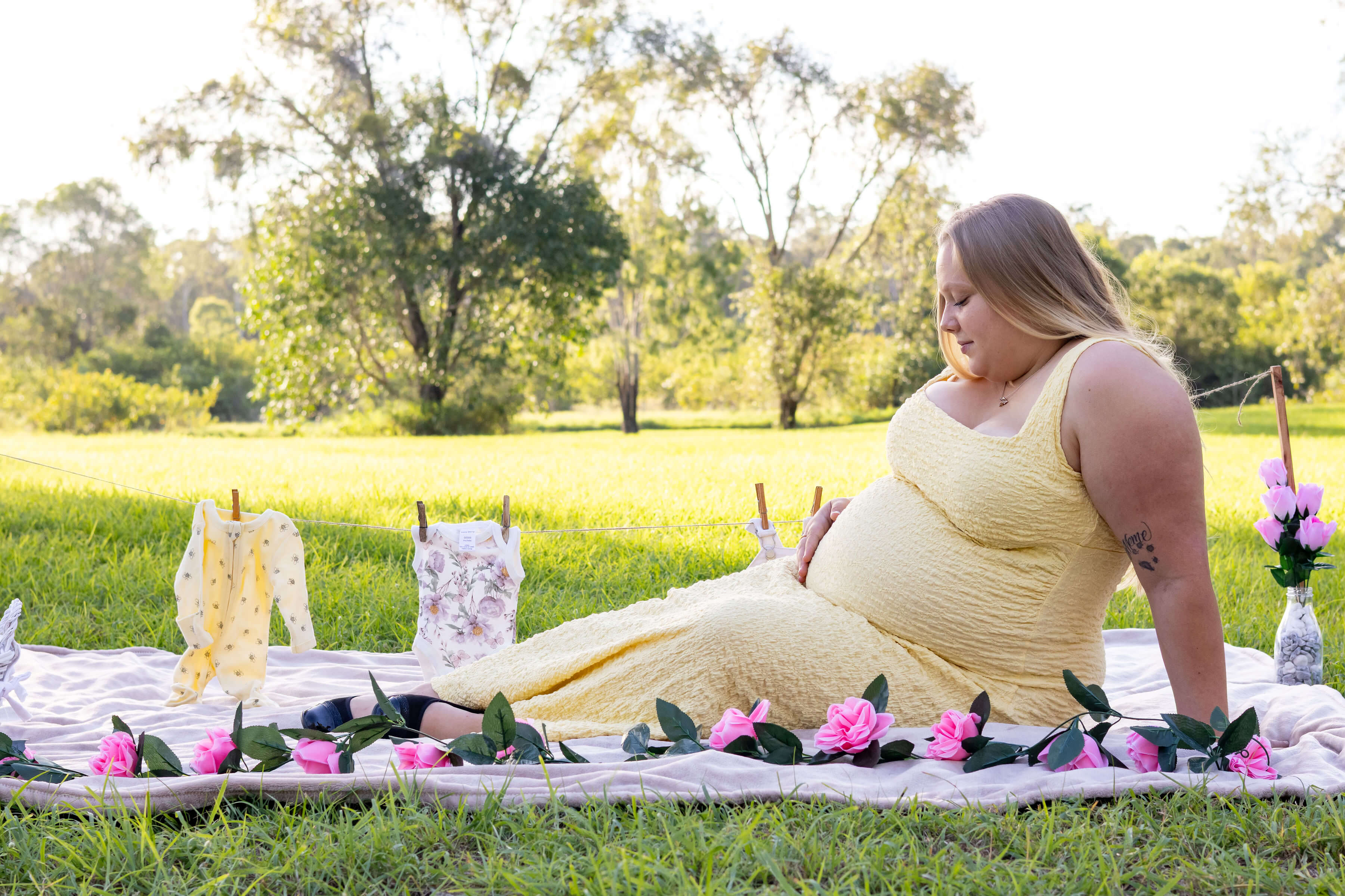 a women in a yellow dress having a picnic