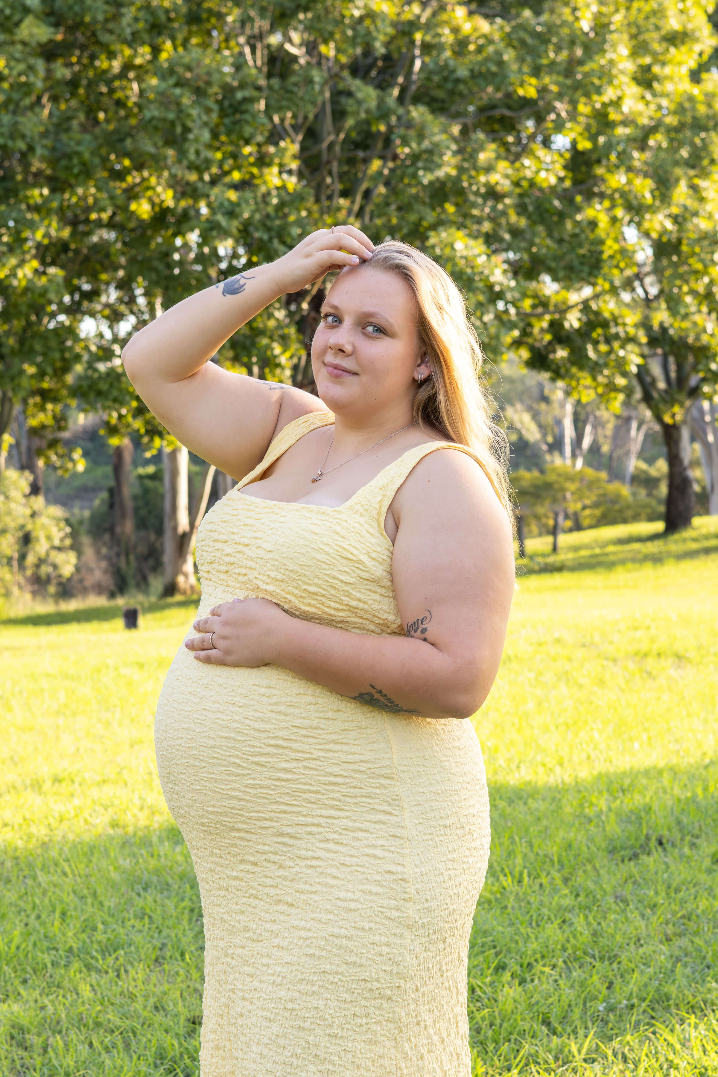 a women in a yellow dress in the park