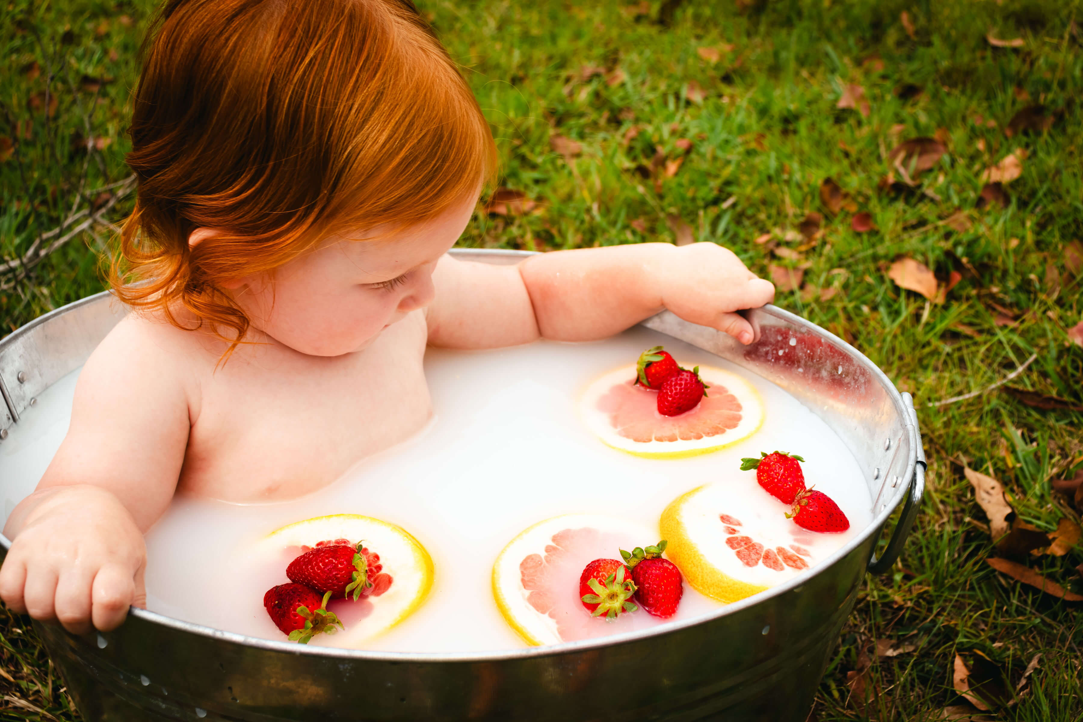 a baby in a milk bath